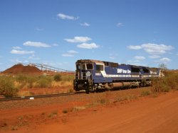 BHP для инвестиций в порт Хедленд для увеличения производства железной руды